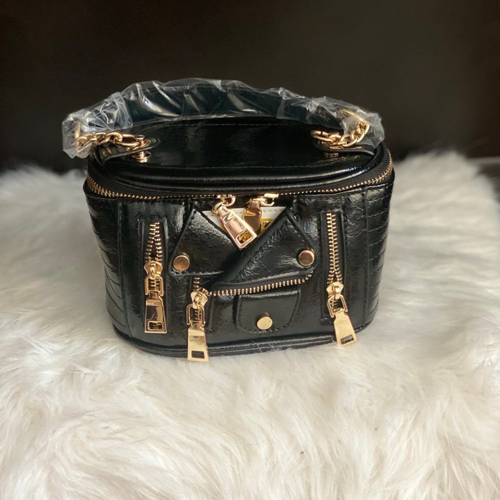 Love X. Clusively Handbag